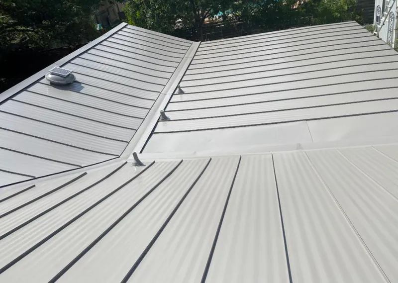 Solar attic fan installed on a metal roof for Roof Ventilation in Yankton